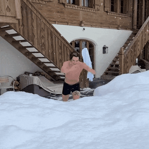A man jumping into snow